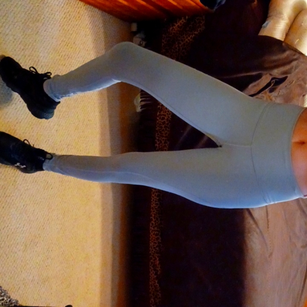 Victoria's Secret gray leggings with cute criss cross design in back. Like new!